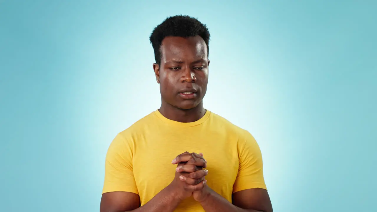 Praying hands and portrait of man with stress