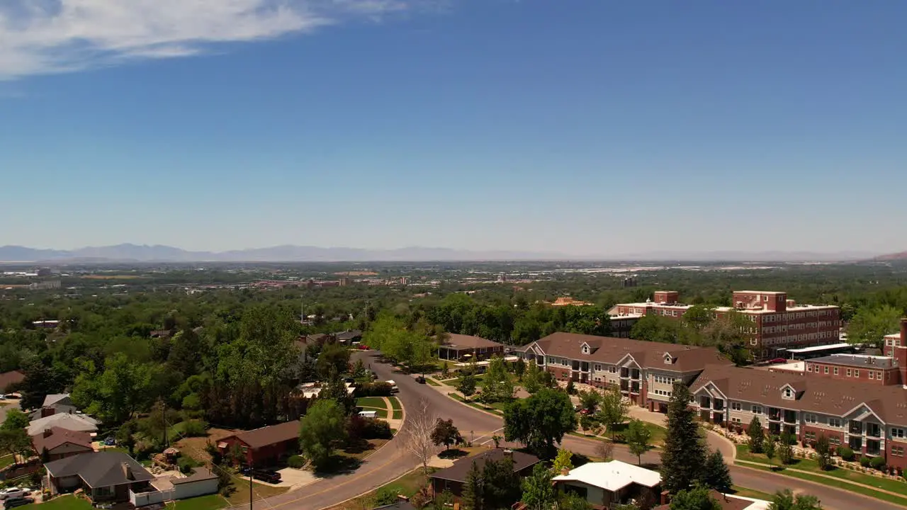 A drone floating over the suburbs and a hospital in the middle of Odgen Utah