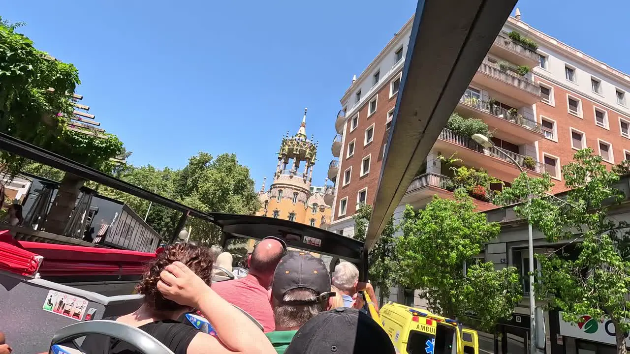 Pov of Buildings and roads while City tour around the city of Barcelona by bus Spain