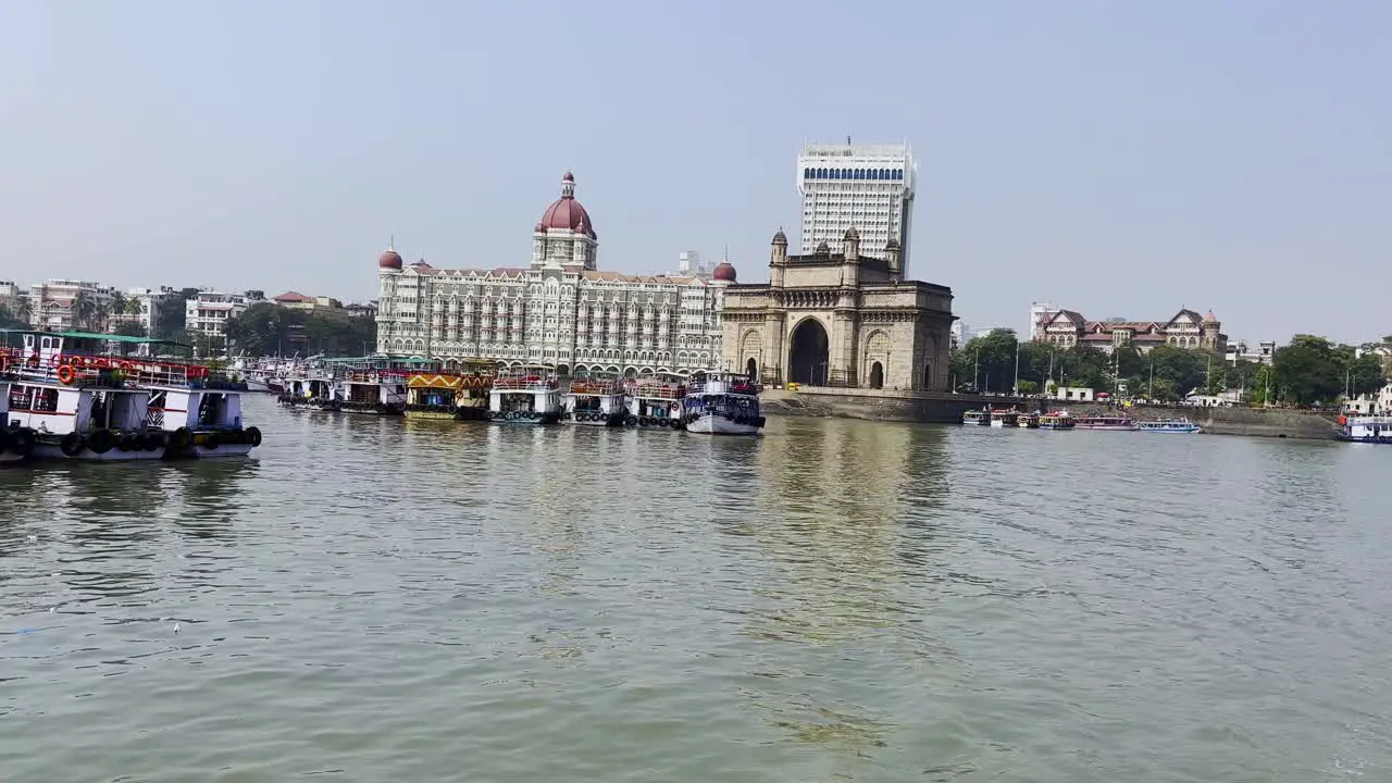 A shot of lot of tourist boats waiting by the sea for the visitors near the Gate Way of India