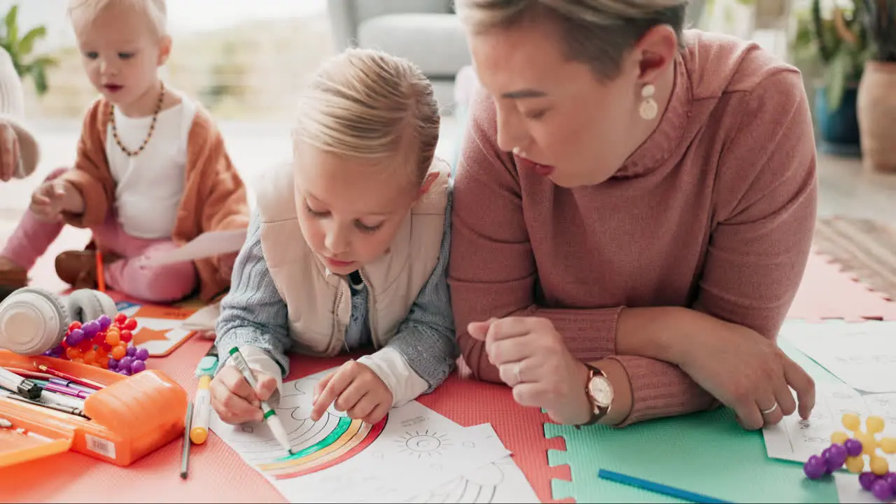 Mother children and drawing on living room floor