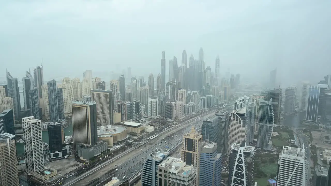 4K Foggy morning at Dubai Marina District Dubai skyscrapers with city traffic