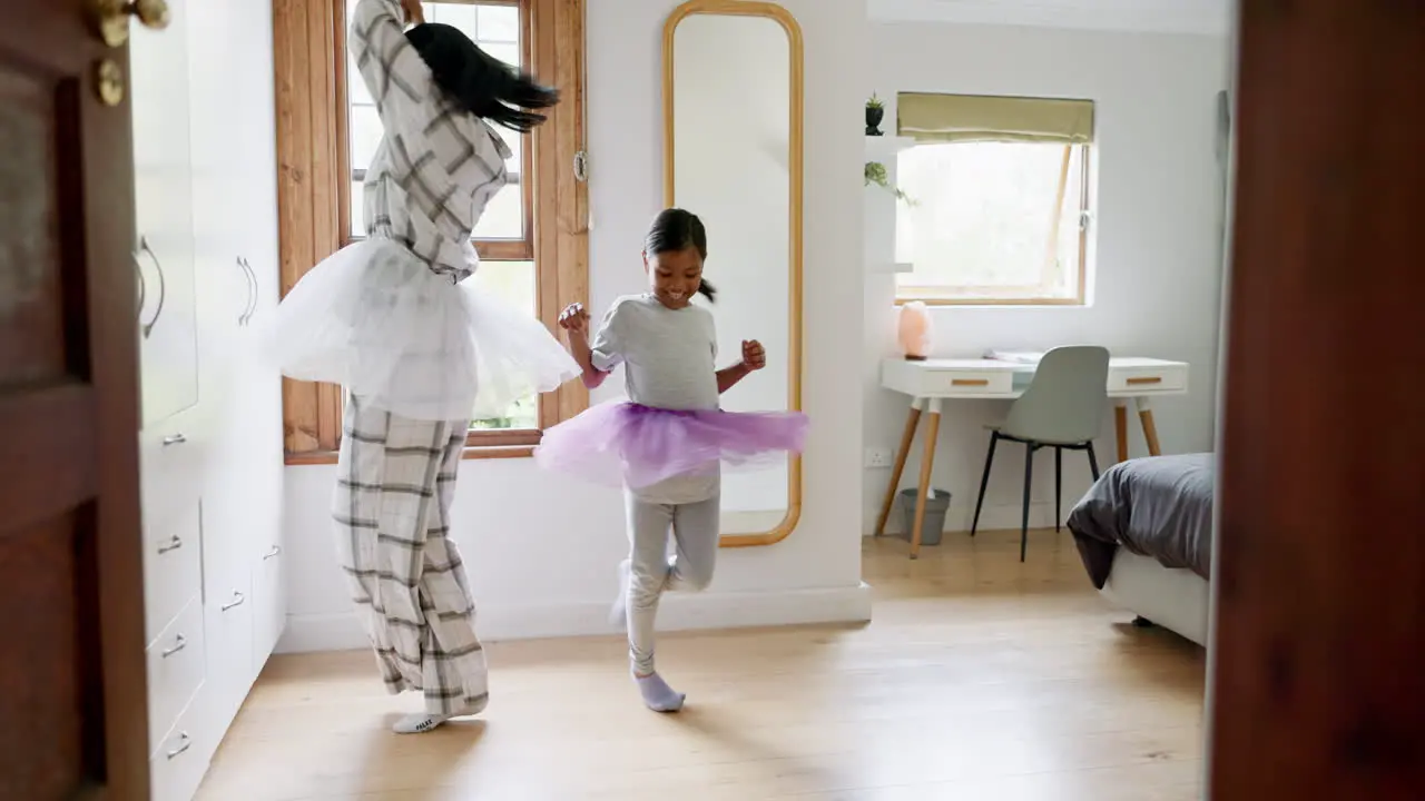 Mom girl ballerina and dancing in house