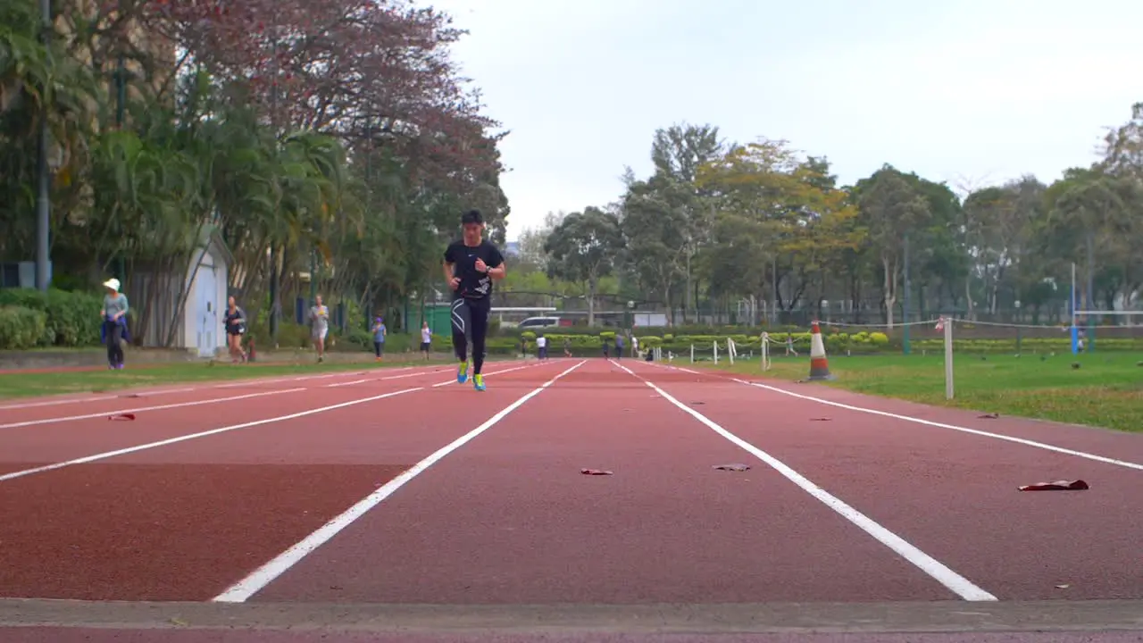 Man Running on a Racetrack