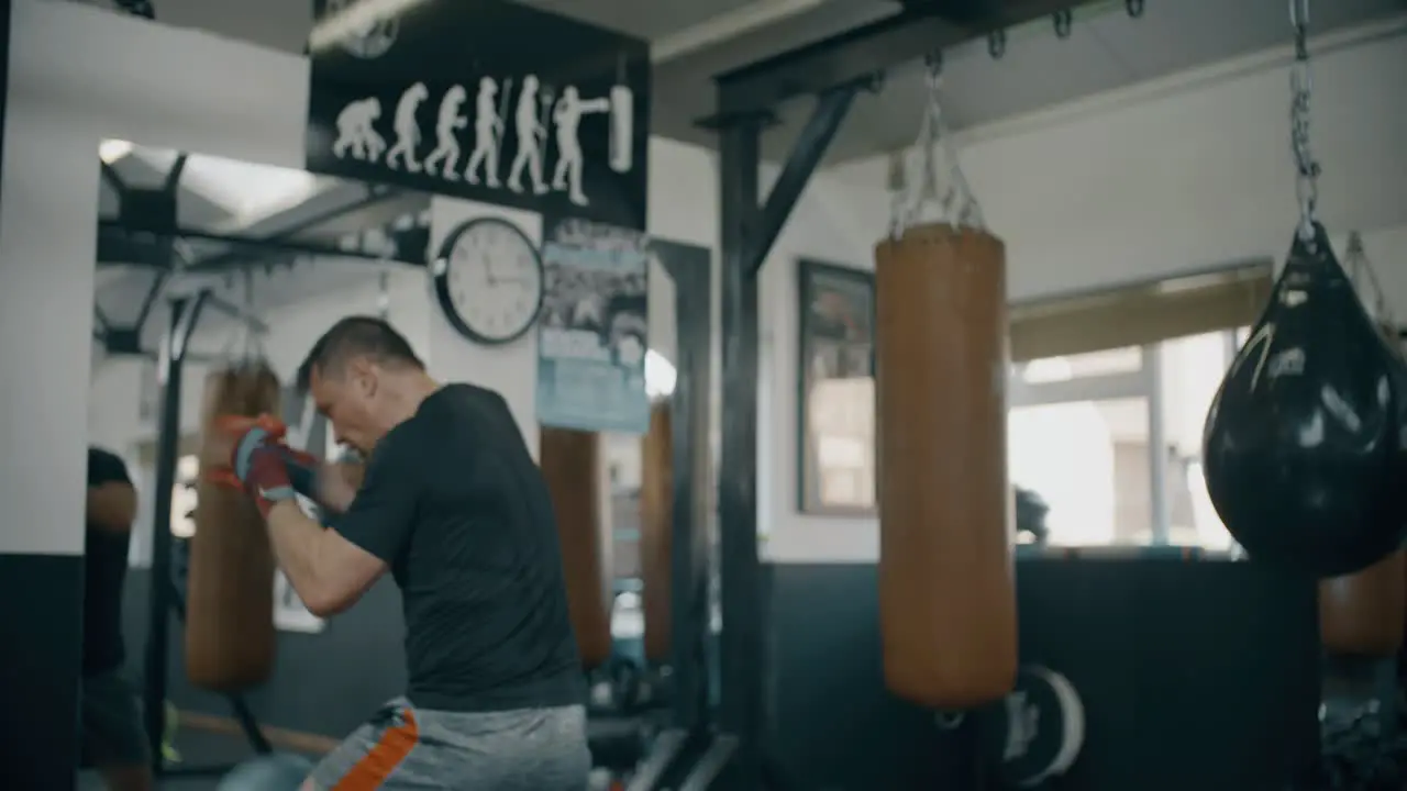 Personal Trainer Working With Boxer