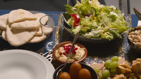 Close Up Of Food On Muslim Family Table At Home Set For Meal Celebrating Eid 2