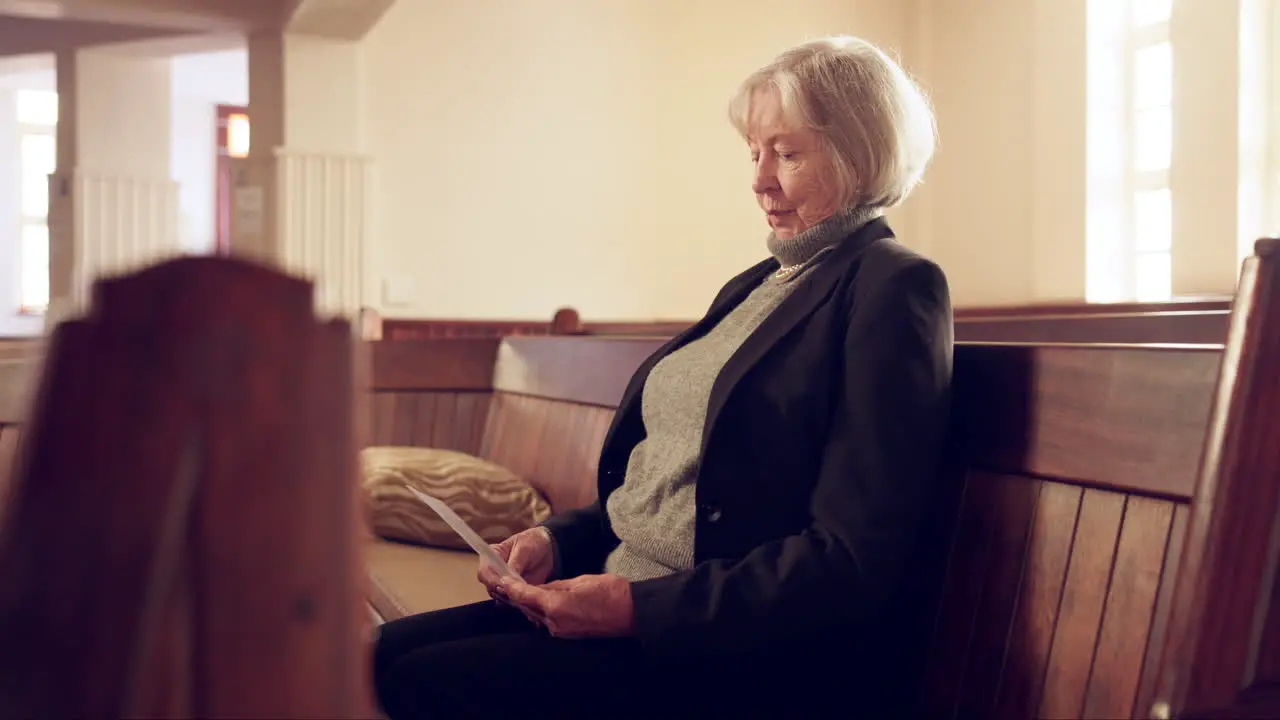 Christian waiting and senior woman in a church