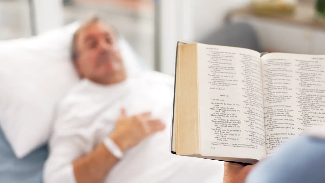 Medical a woman reading the bible to her husband