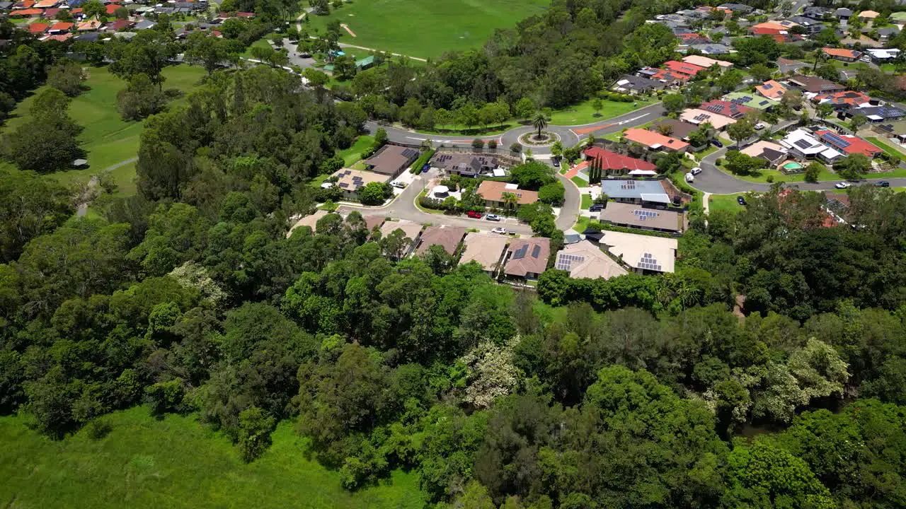 Aerial over Mudgeeraba Creek and residential housing Gold Coast Queensland Australia