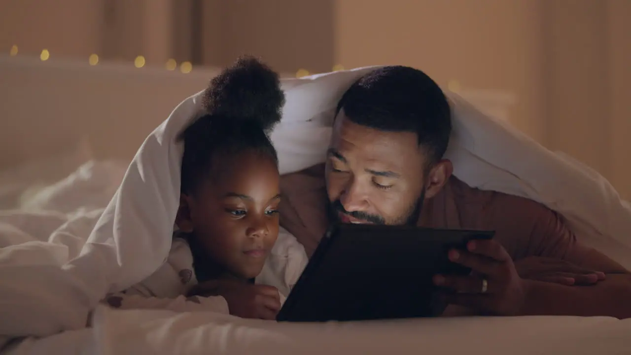 Father girl and tablet in bed