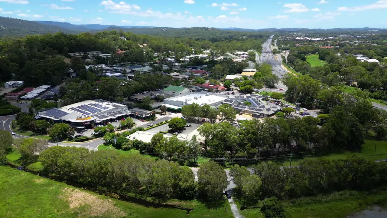 Aerial over Mudgeeraba Market Shopping Centre and Firth park Gold Coast Queensland Australia