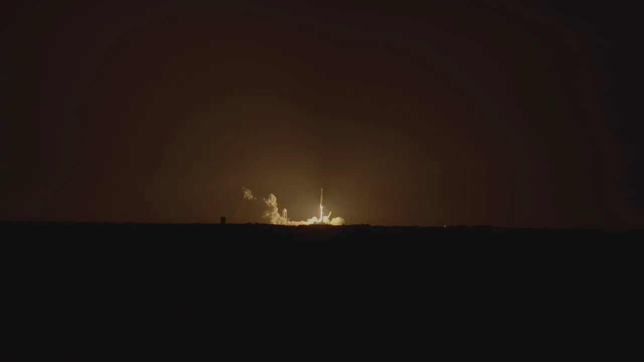 A shuttle is launched in the night