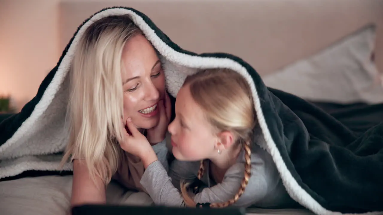 Mom daughter and tablet in bedroom