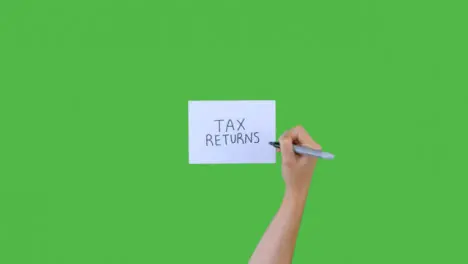 Woman Writing Tax Returns on Paper with Green Screen 02