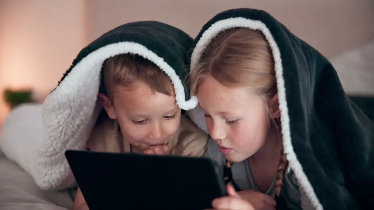 Boy girl and tablet in bedroom