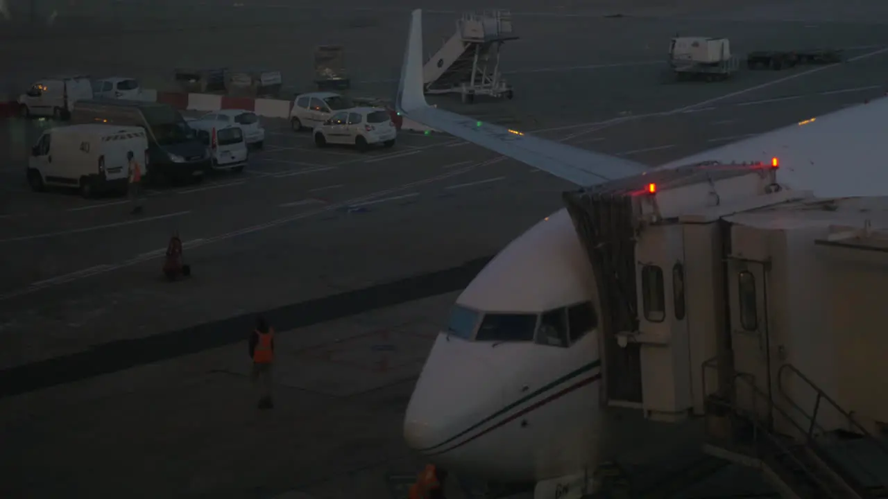 Airplane is prepared for boarding passengers at night