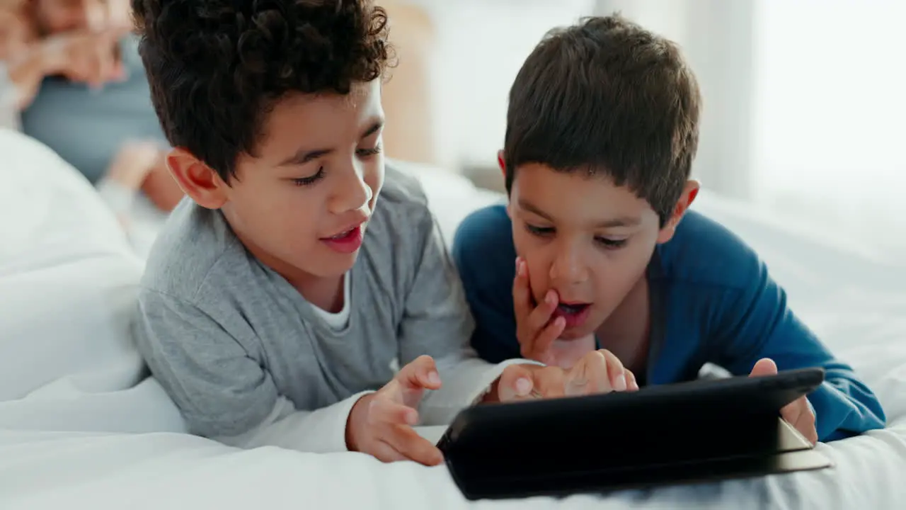 Boy children tablet and parents in bedroom