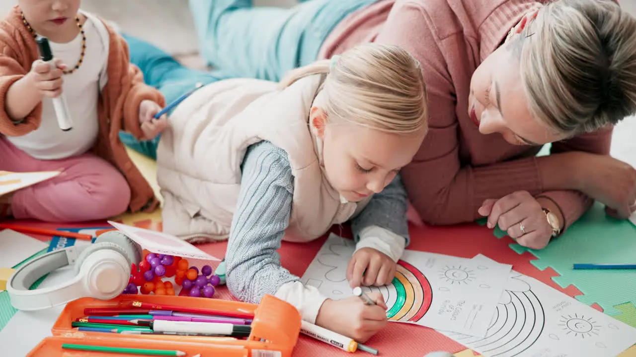 Mom children and drawing on living room floor