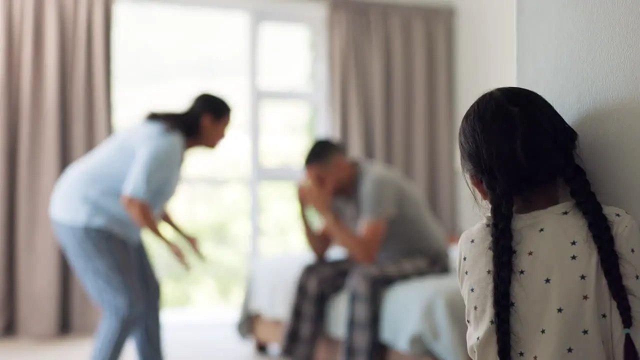 Parents fighting and girl in a family home