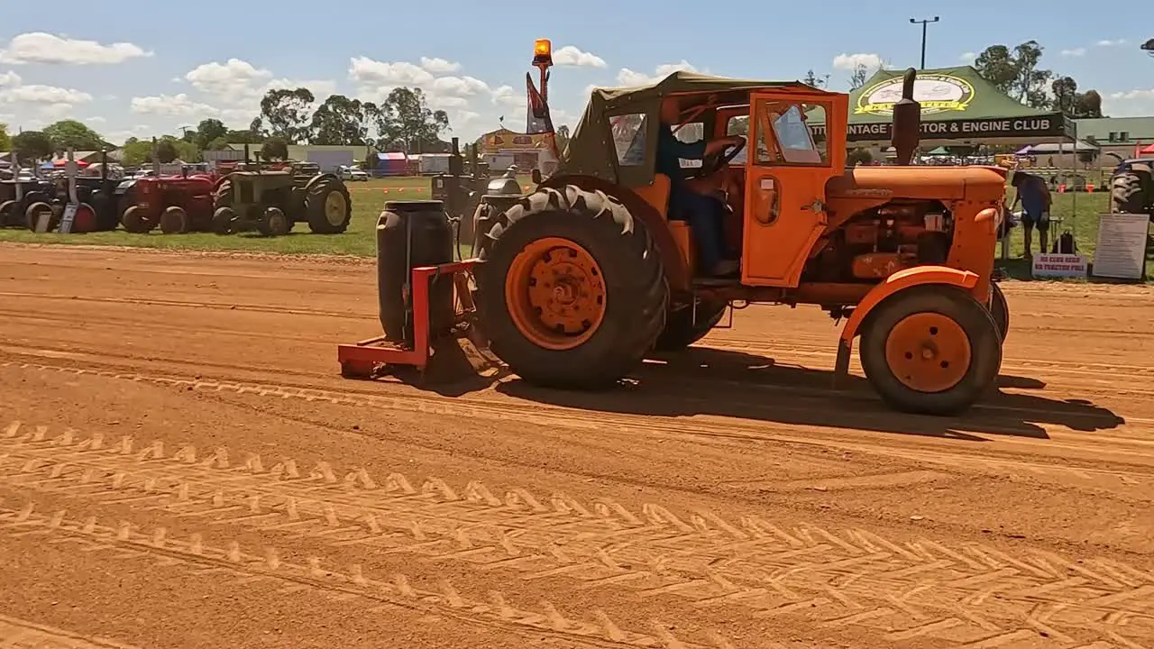 Yarrawonga Victoria Australia 7 October 2023 Old orange tractor grading the tractor pull track at the Yarrawonga Show in Victoria Australia