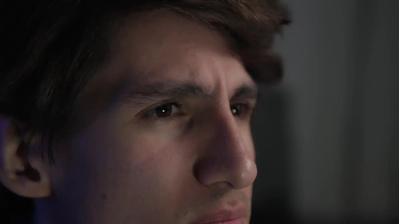 Young Man Focusing On Playing Video Games Close-up