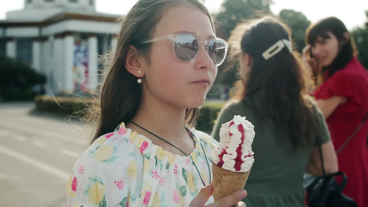 Stylish teenager enjoying ice cream outside