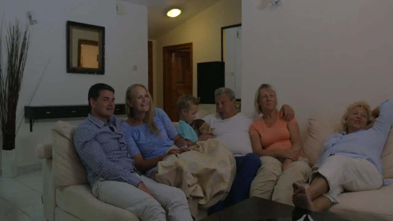 Family spending leisure with TV