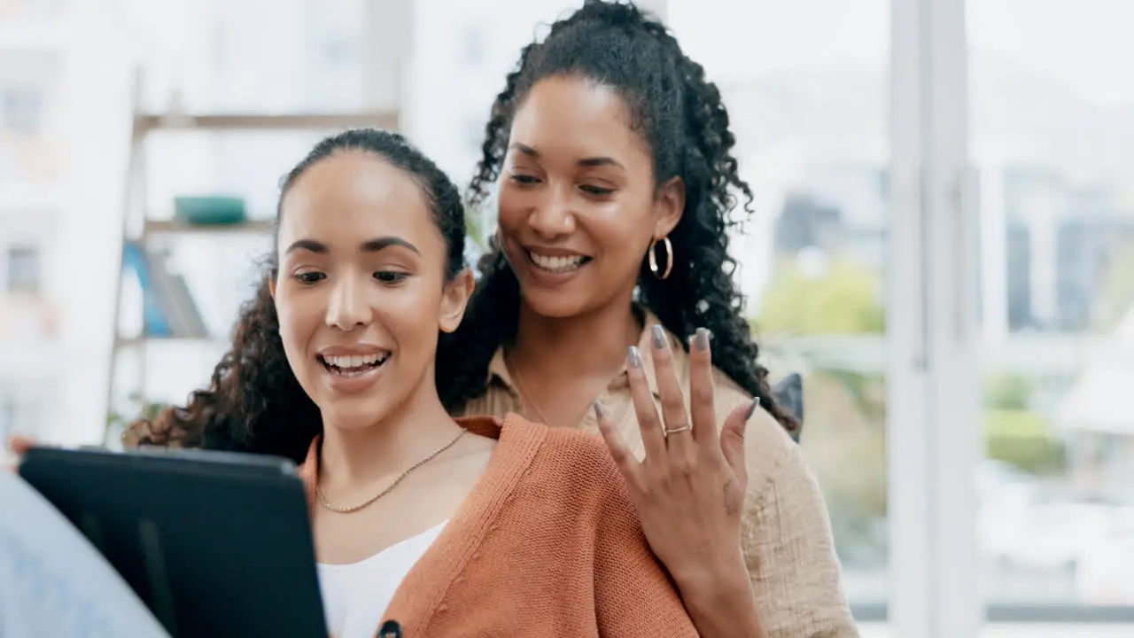 Lesbian couple and women relax with tablet