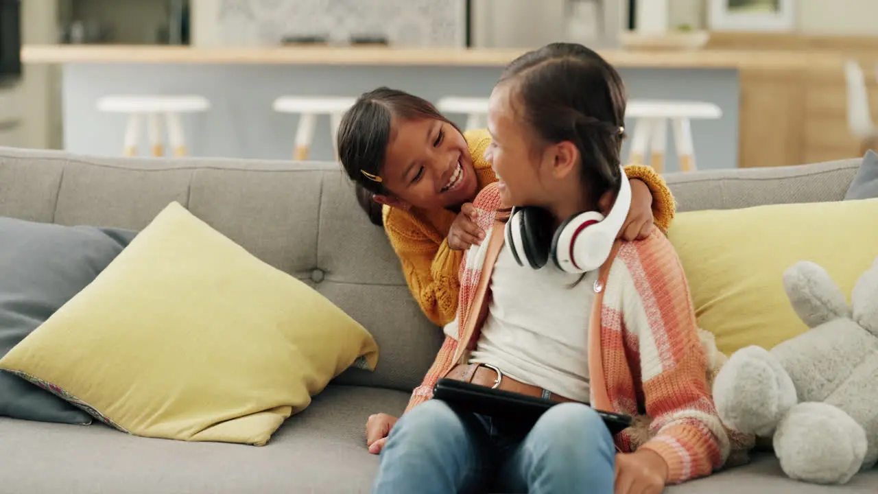 Sisters playing and kid with headphone