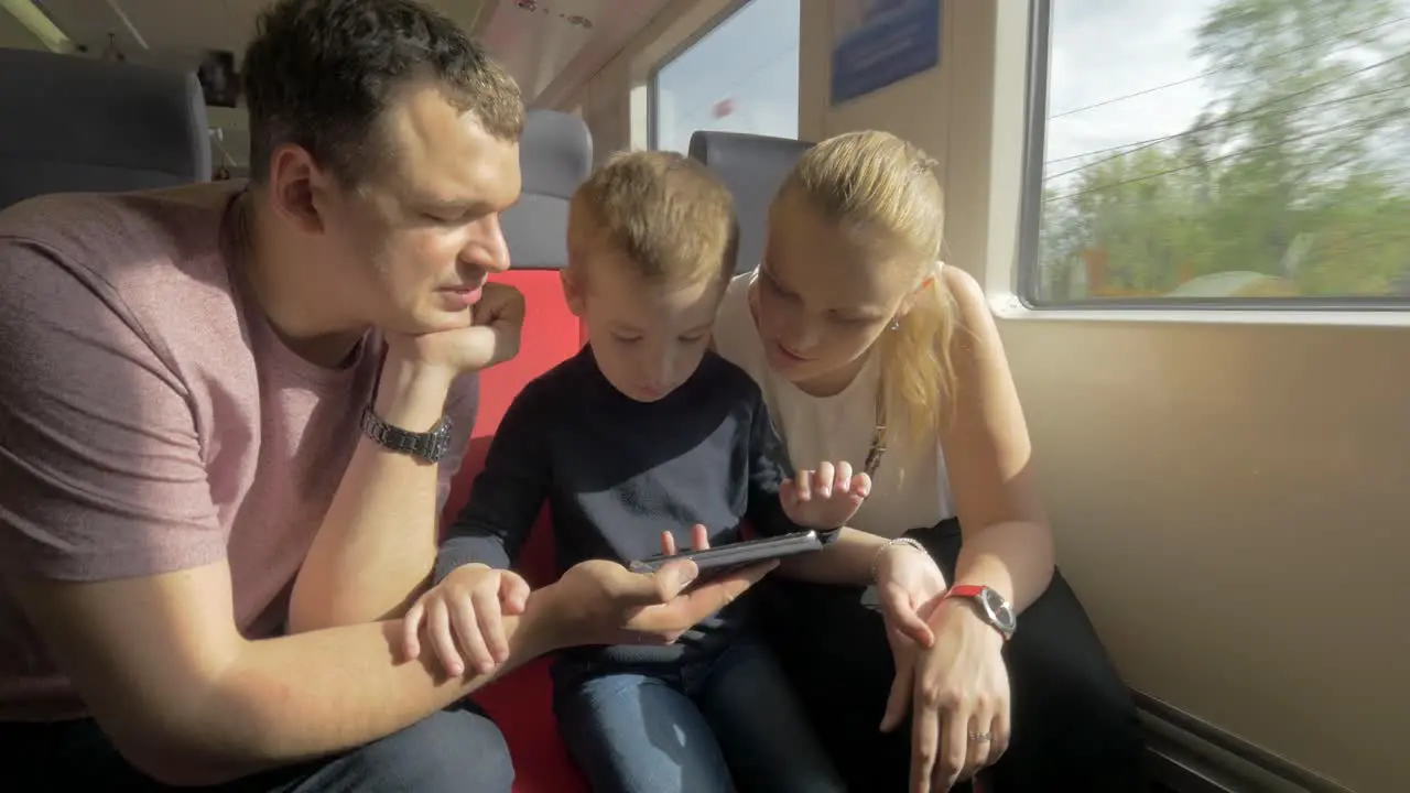 View of a young family in the railway trip