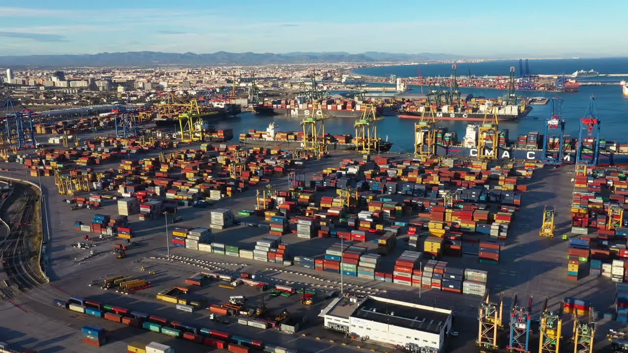 Busy Port of Valencia dockyard workers with trucs Spain maritime harbour