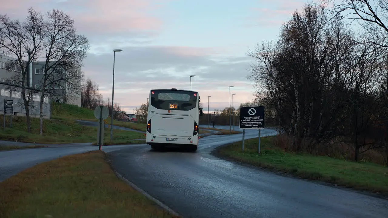 Buses Driving On The Street At Sunrise In Tromso Norway