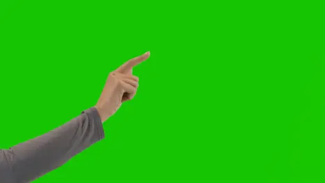 Studio Close Up Shot Of Woman Pretending To Tap And Swipe Controls Against Green Screen