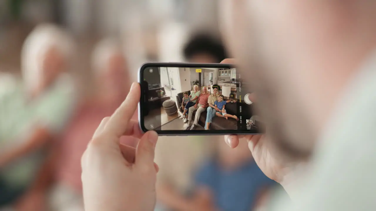 Phone screen and hands for family picture