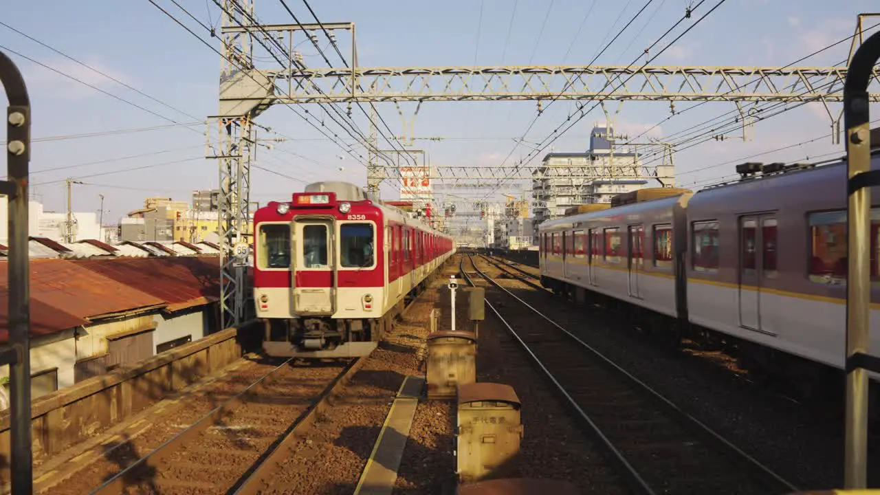 Trains Departing Tsuruhashi Station in Osaka Japan on a Sunny Day