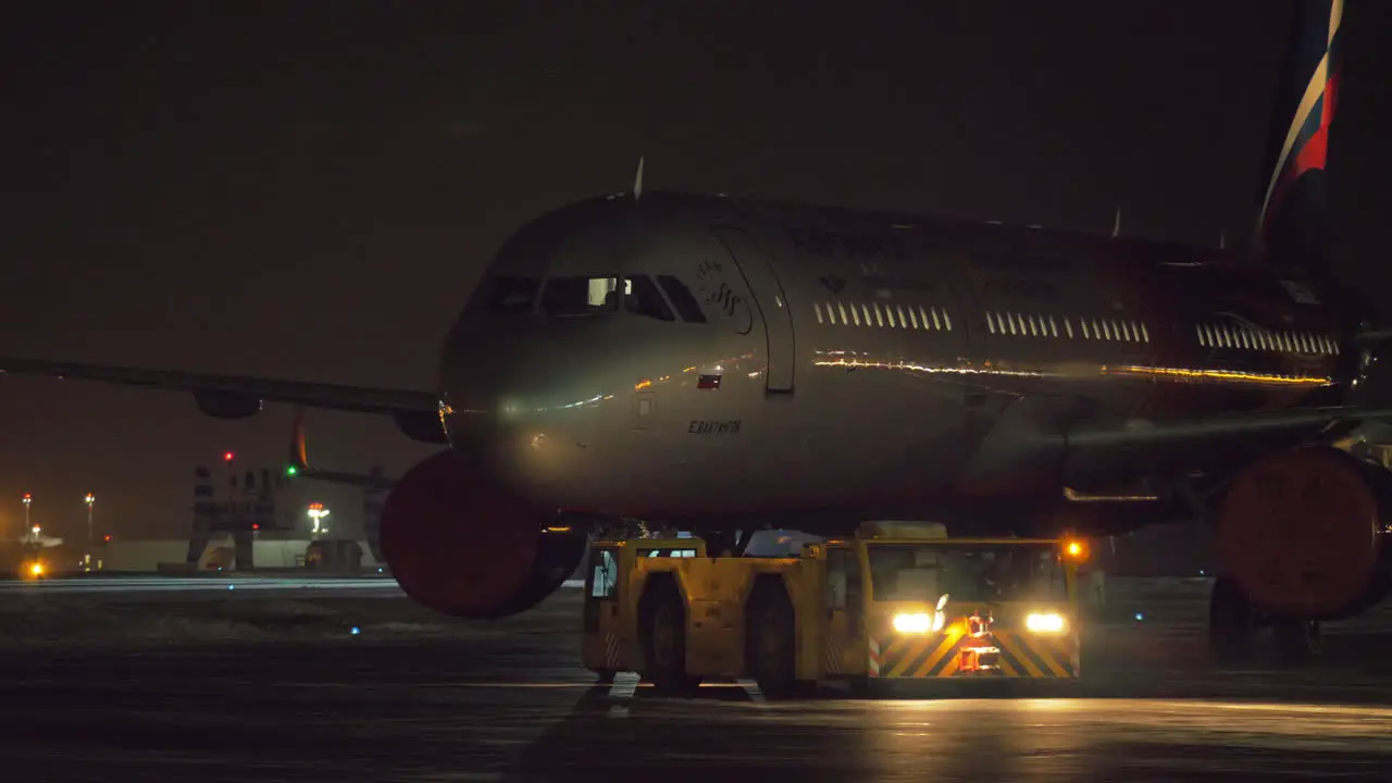 Towing Aeroflot aircraft at night