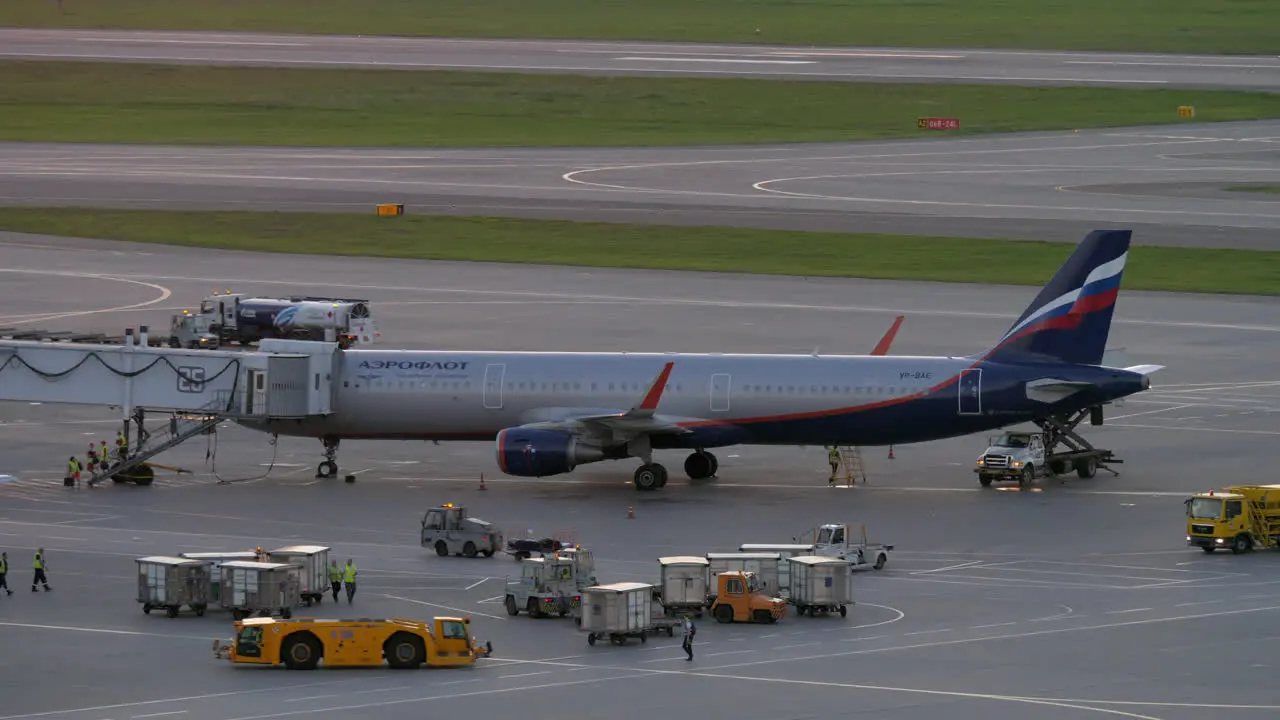 At the airport Plane deboarding and transport traffic