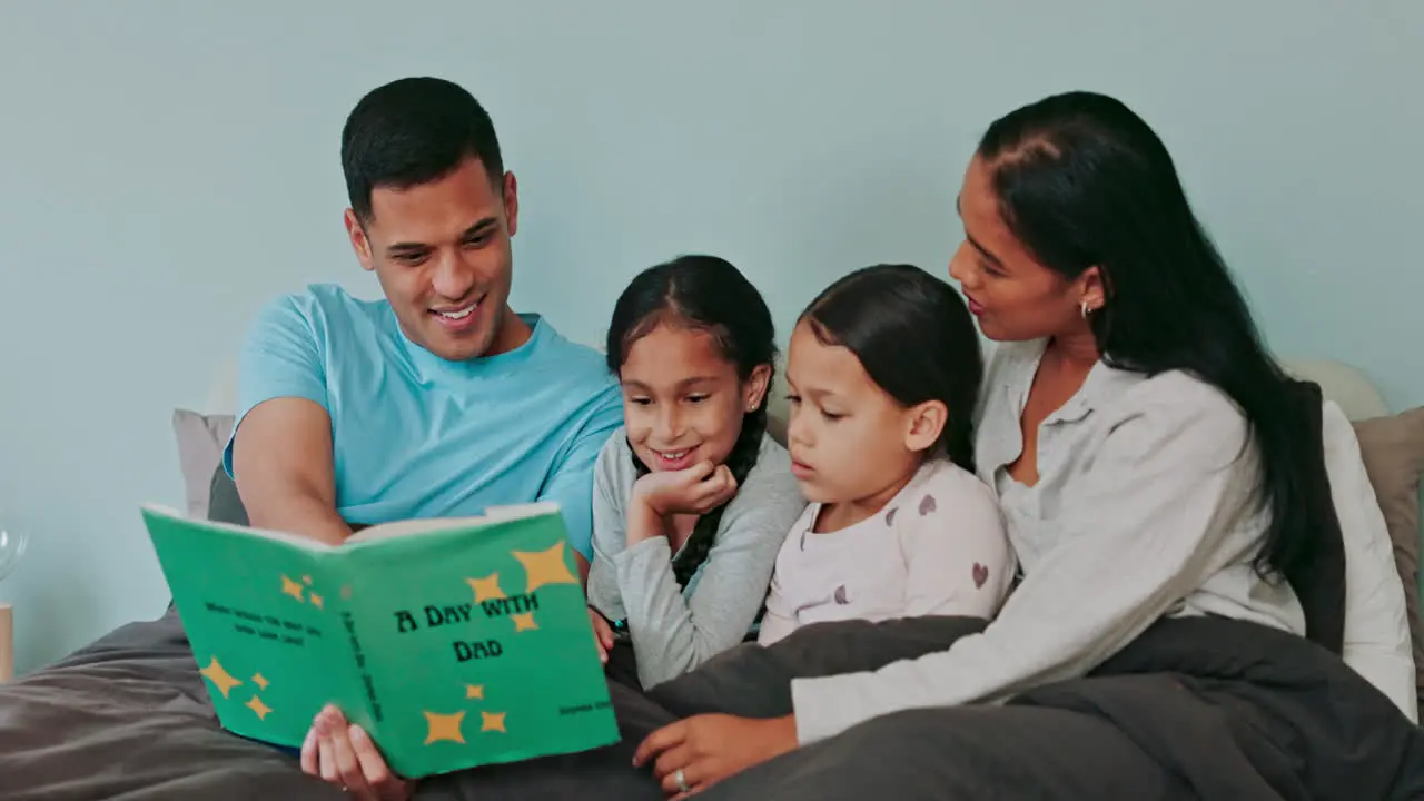 Dad mom and children reading books in bedroom