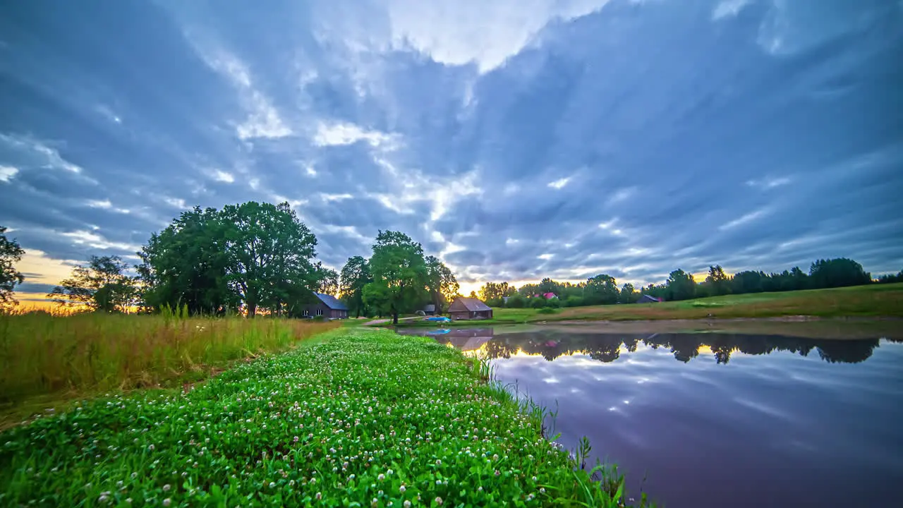 Stunning timelapse of clouds moving across the sunset over the lake