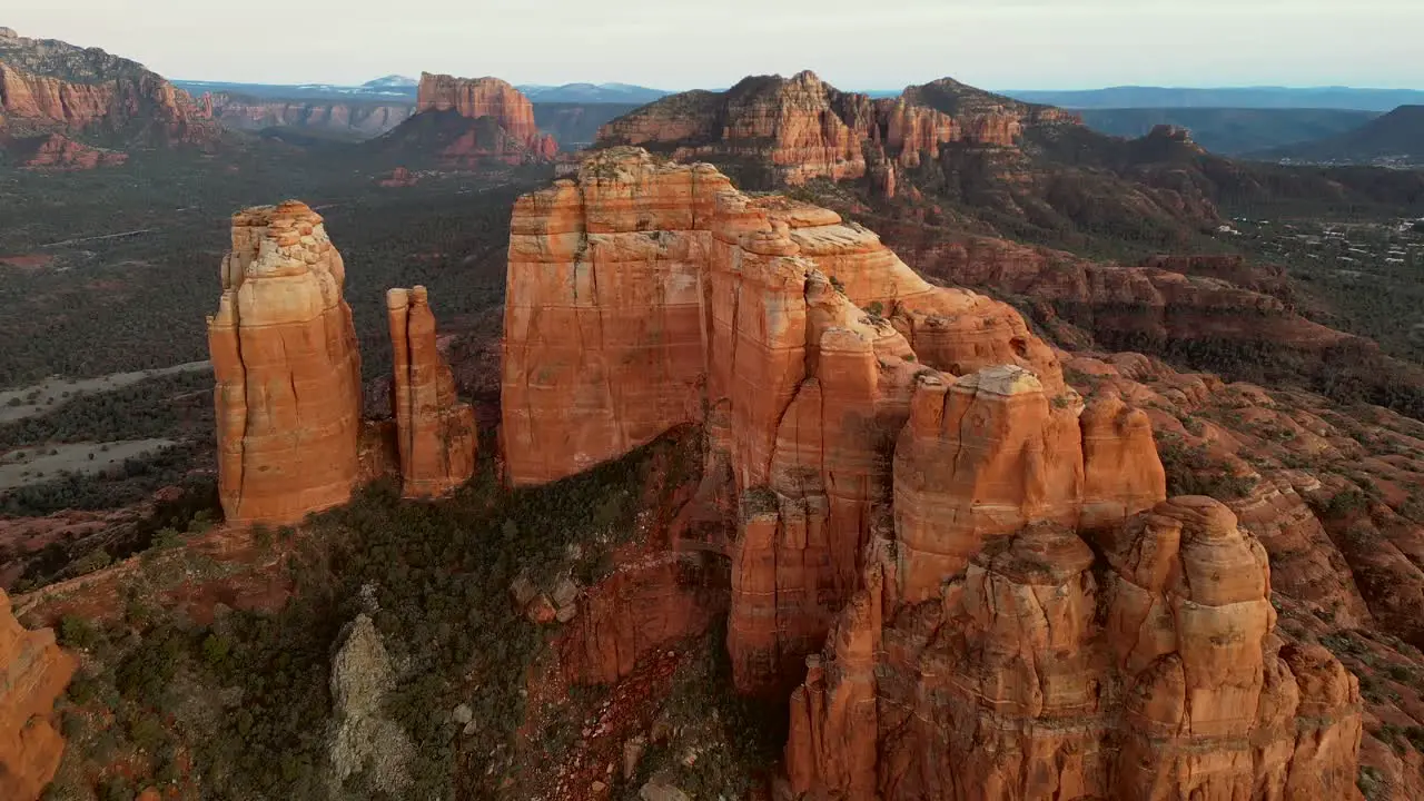 Top Down aerial view pulling away reveal of Cathedral Rock in Sedona Arizona at sunset