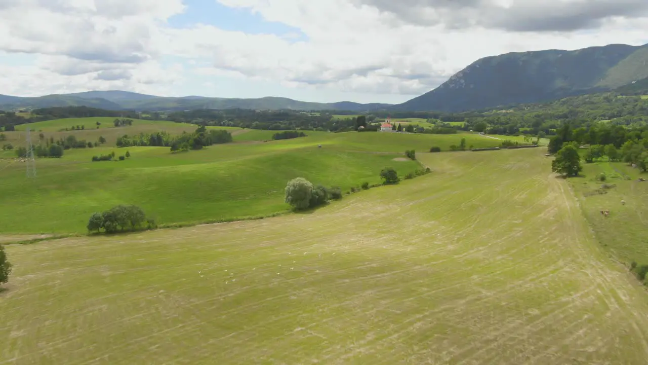 A drone shot of a church on top of the hill