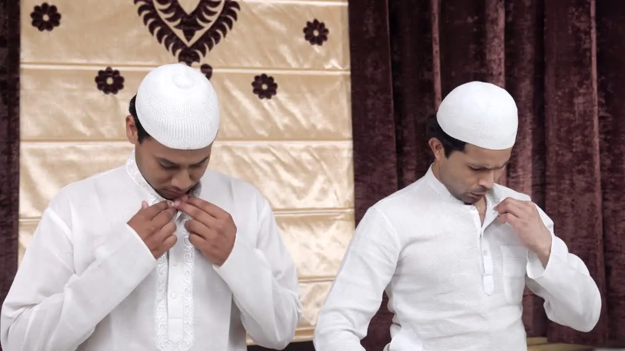 Muslim men doing rituals of muslim prayer