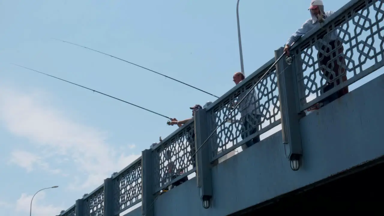 An Istanbul fisherman fishes from the Galata bridge in Istanbul Turkey on July 9 2022