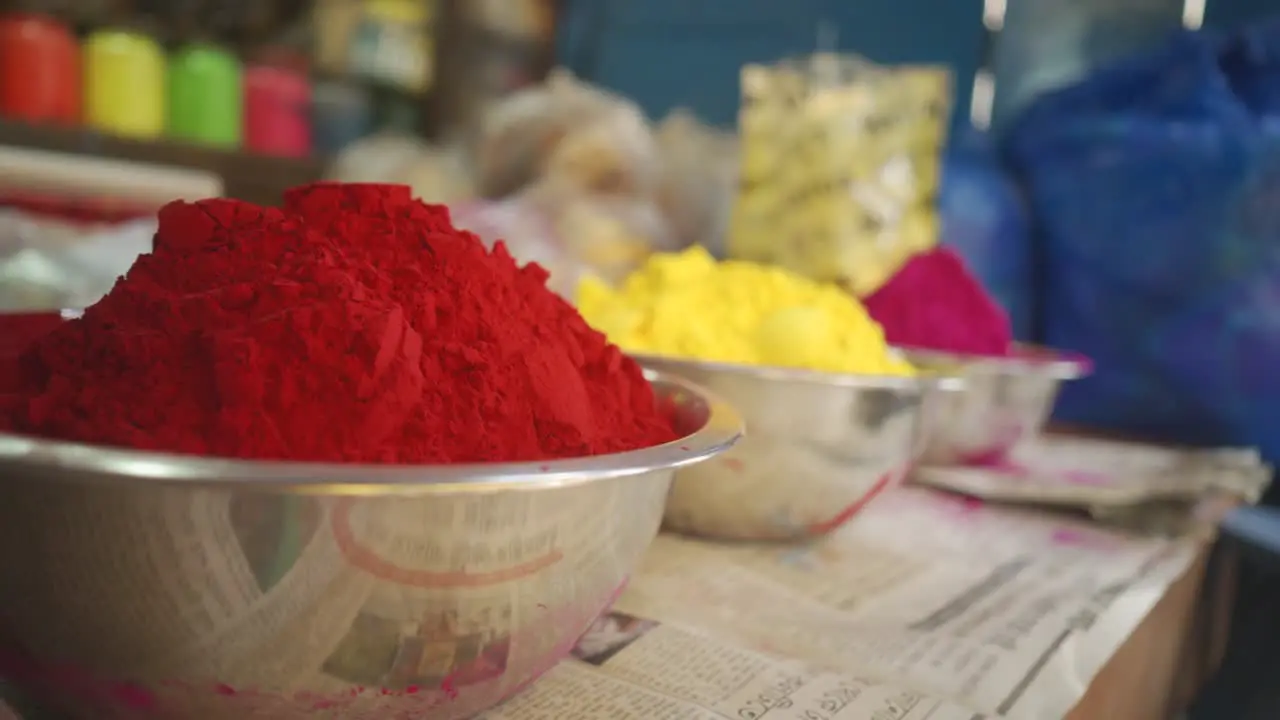 Color powders or gulal on bowl or container for sell on shop Holi Indian festival of colors