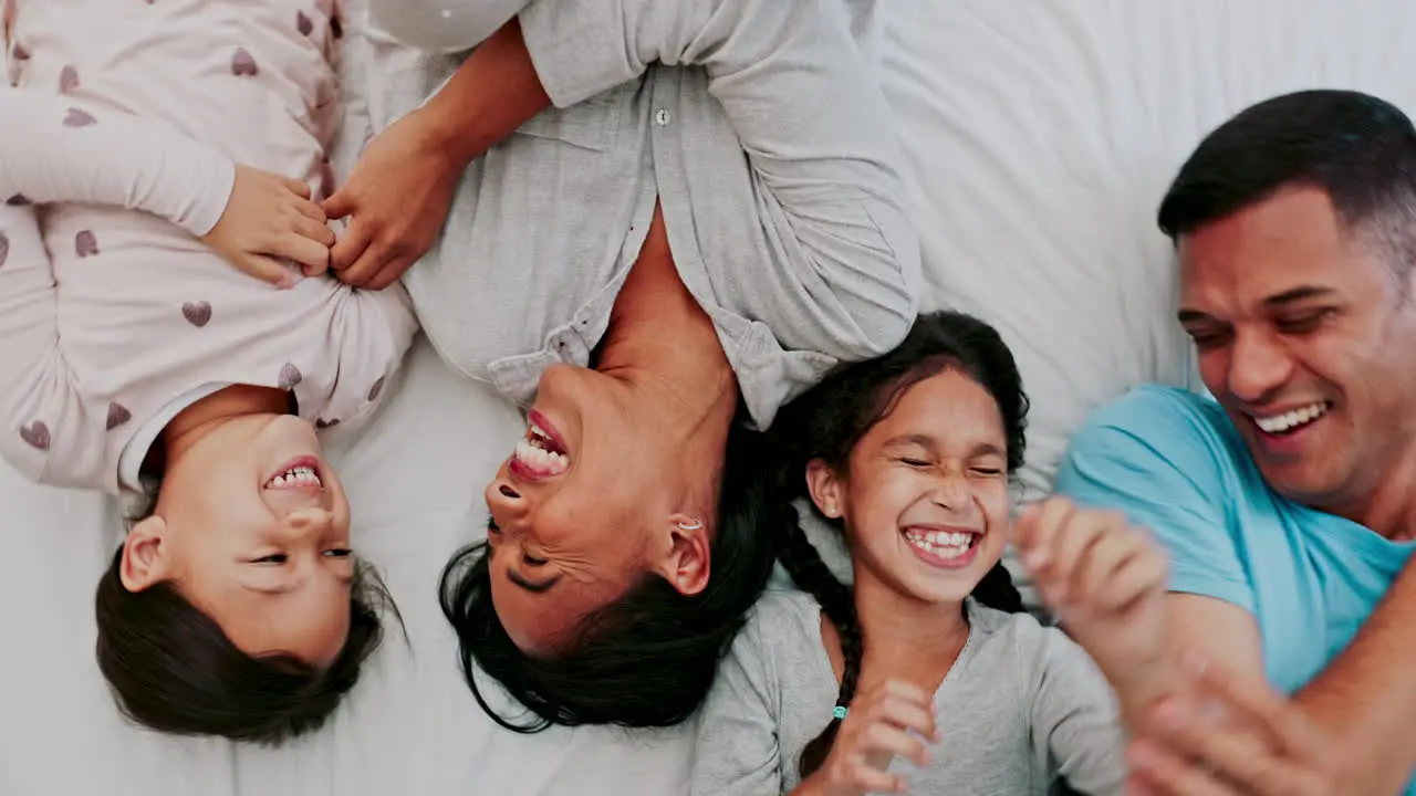 Kids parents and playing at bed time together