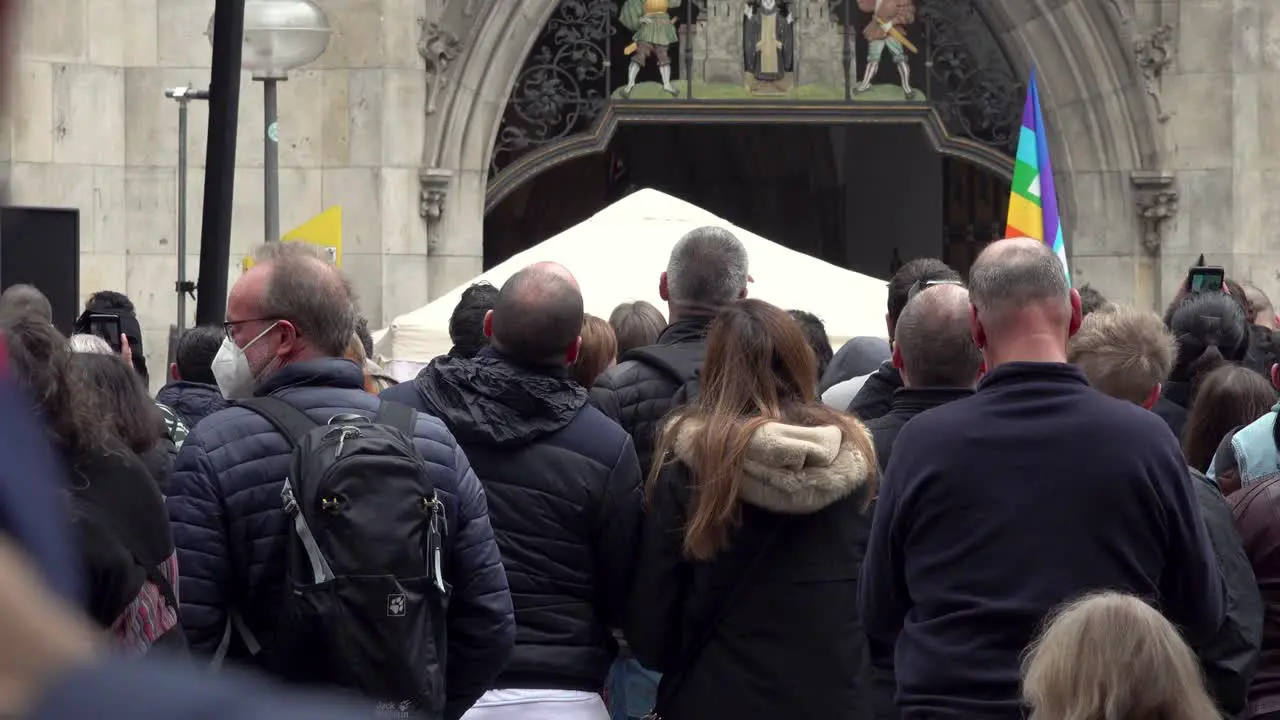 A group of people standing and waiting for something to commence