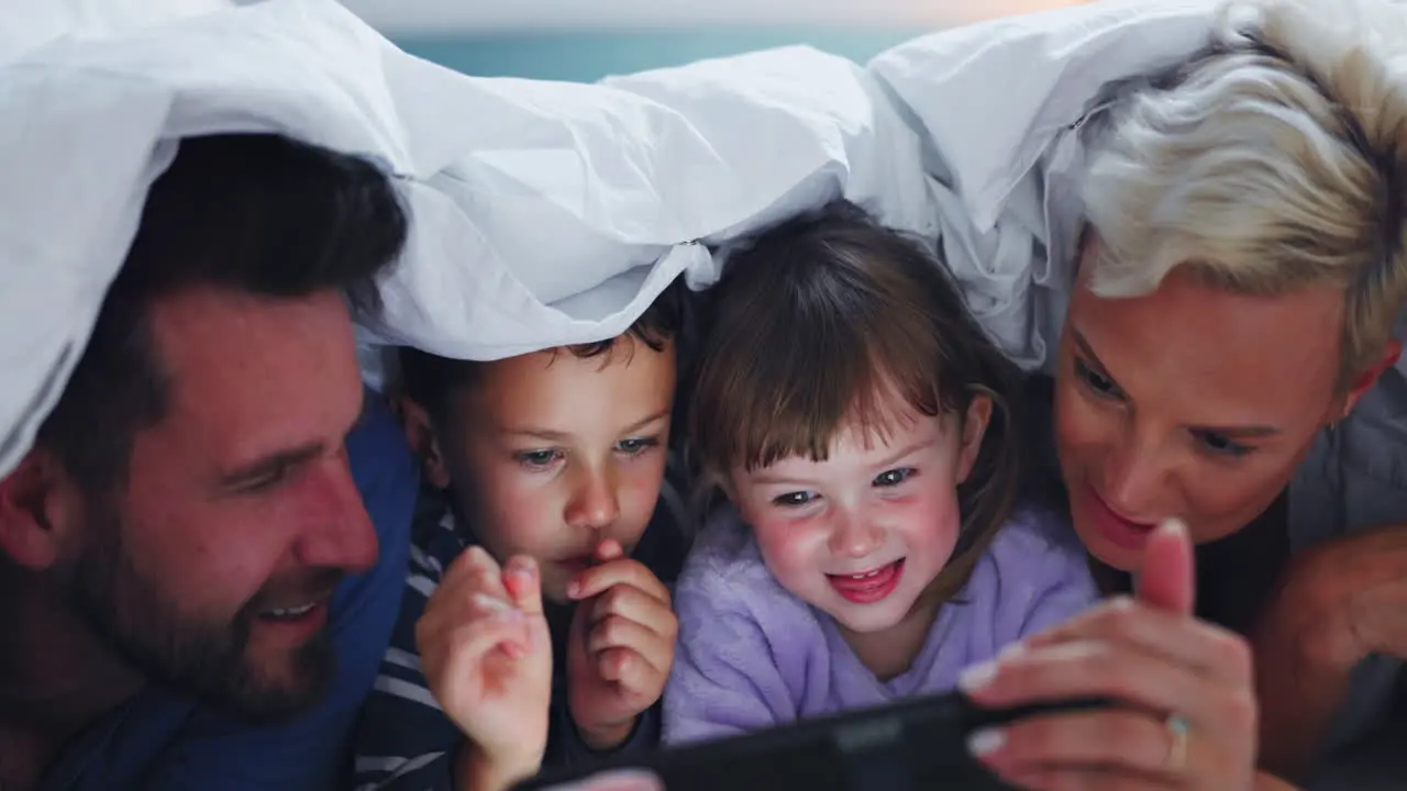 Parents children and night with tablet