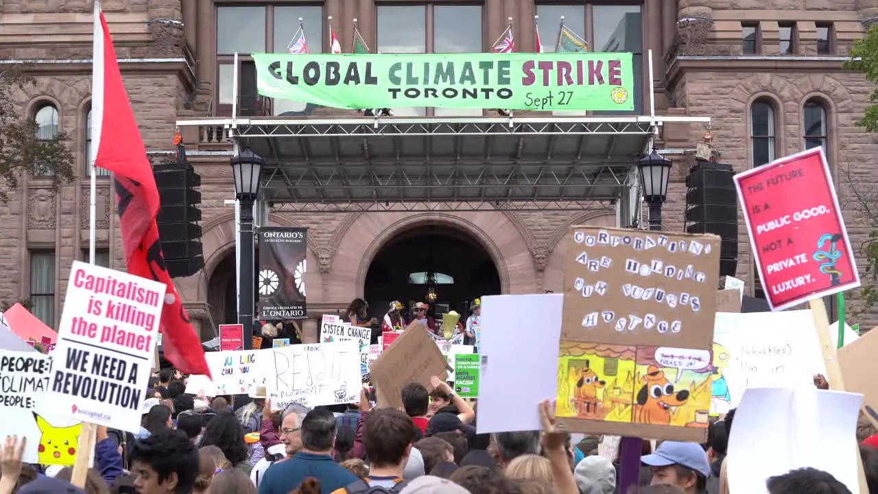 Crowds protesting climate change queens park Toronto