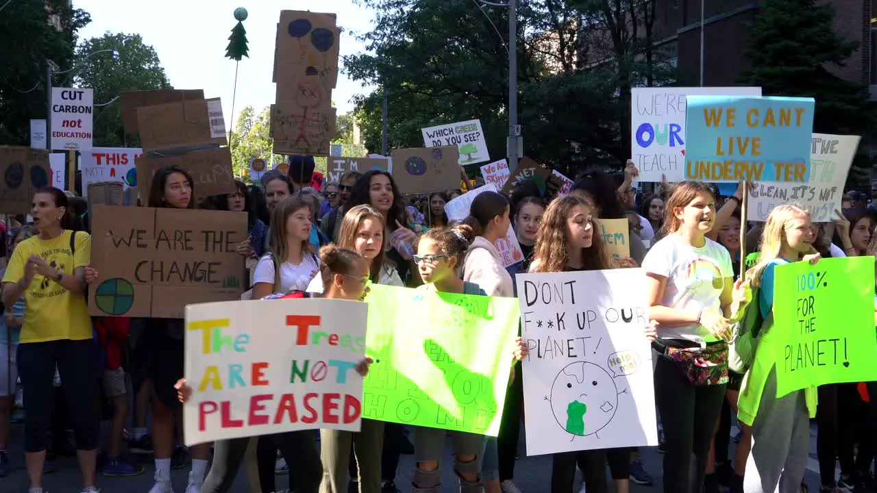 Children with signs protesting Global Climate Change March