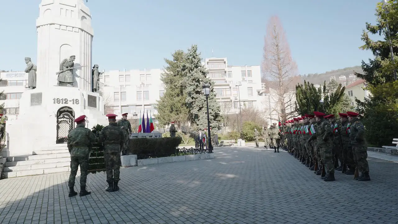 Uniformed soldiers on memorial parade at Mother Bulgaria cenotaph on Independence day